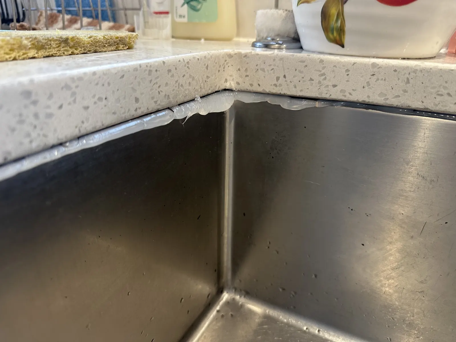 Old silicone removed and fresh silicone applied along the sink and benchtop joint in East Tamaki