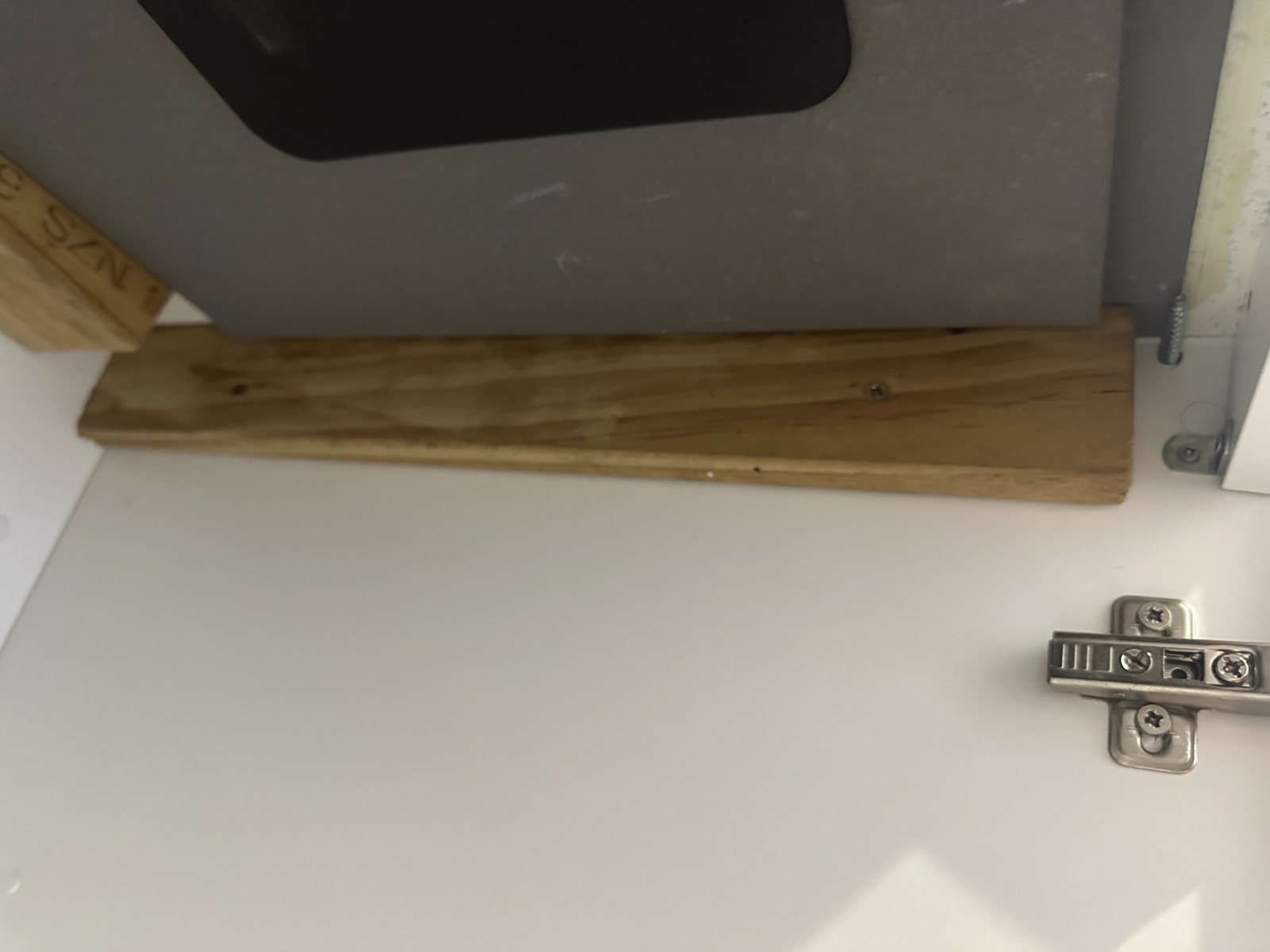 Custom timber support bracket fitted underneath the kitchen sink in East Tamaki