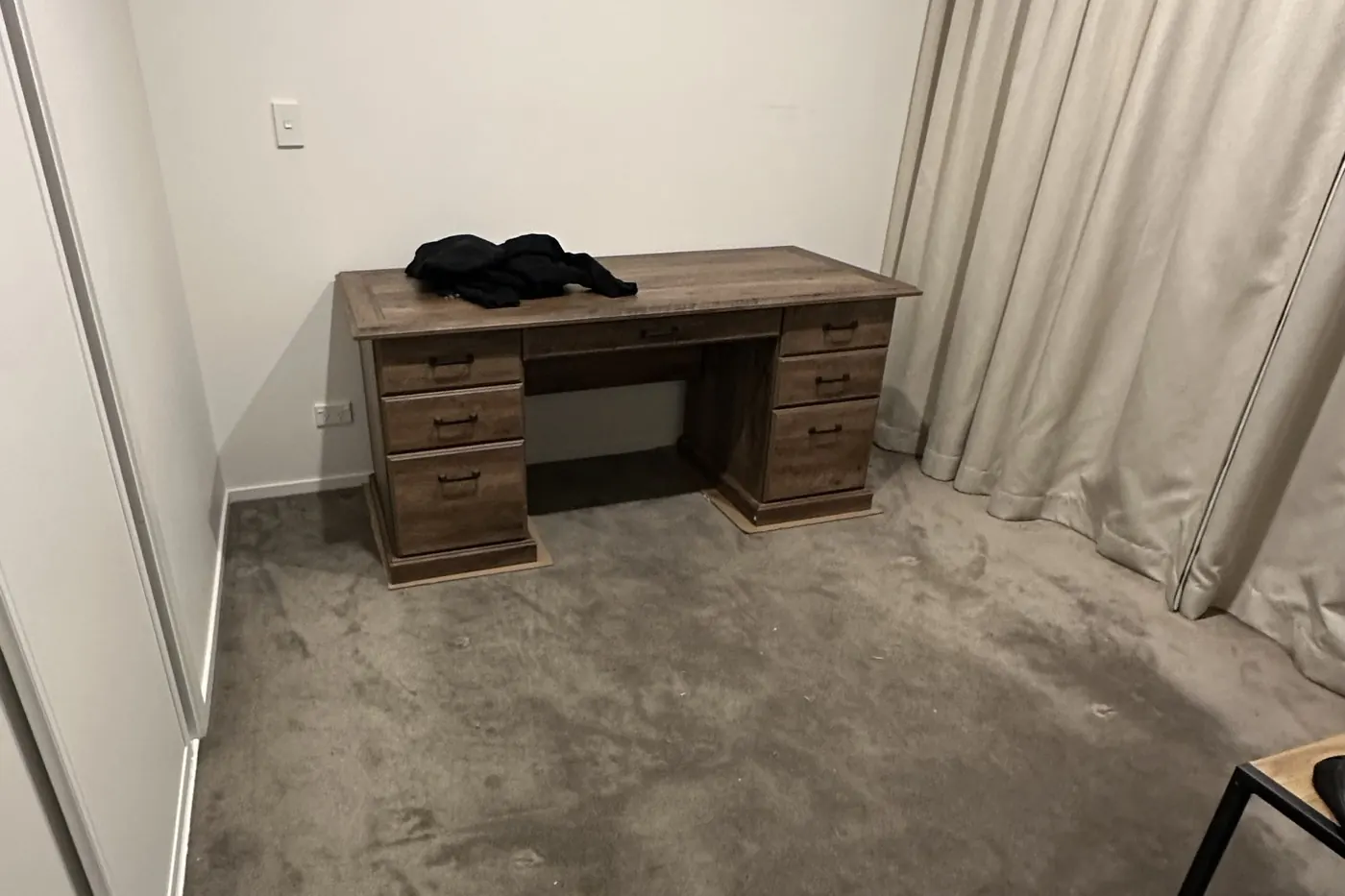 The finished executive desk assembled and standing against the wall in the same Parnell room