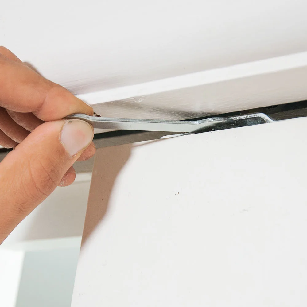Fine-tuning the top roller to bring the cavity sliding door level