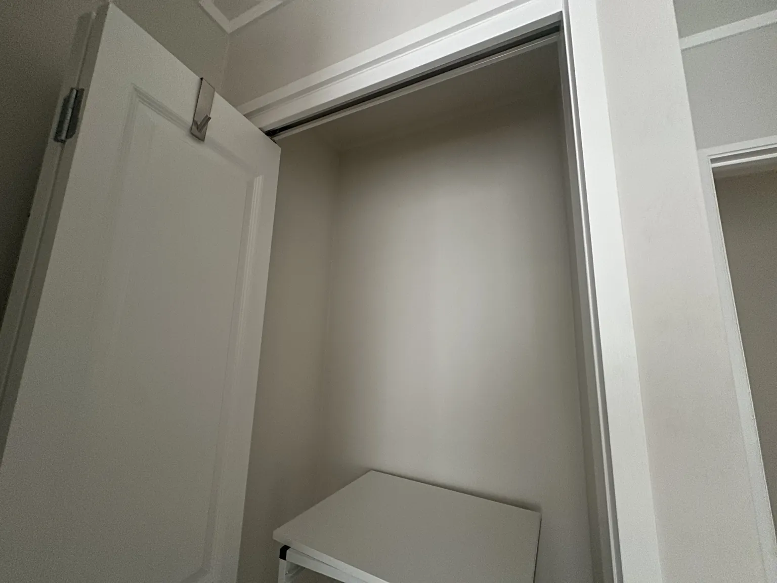 Existing wardrobe before custom timber shelf and hanging rail installation in Somerville, East Auckland