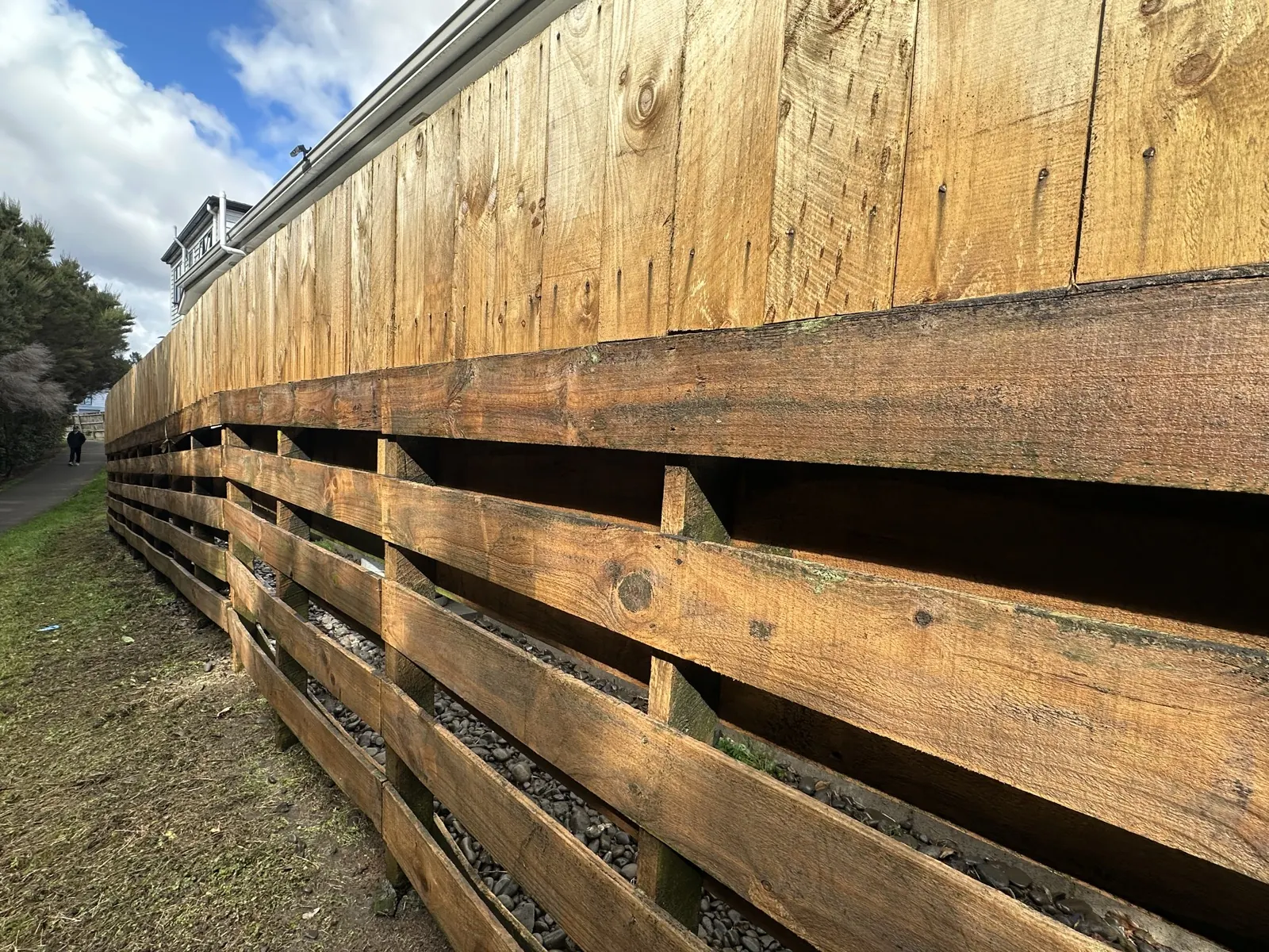 Fence washed back to bare timber after water blasting in Sunnyhills