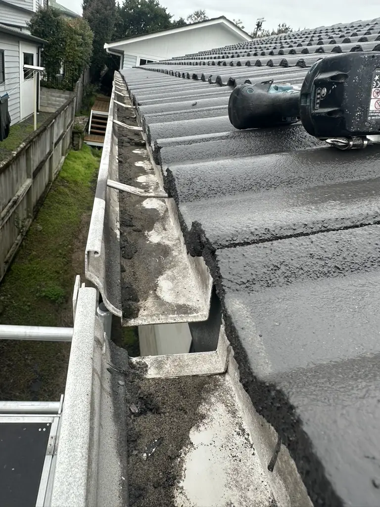 View along the repaired gutter from the top of the scaffold in Howick, with the concrete tile roof alongside