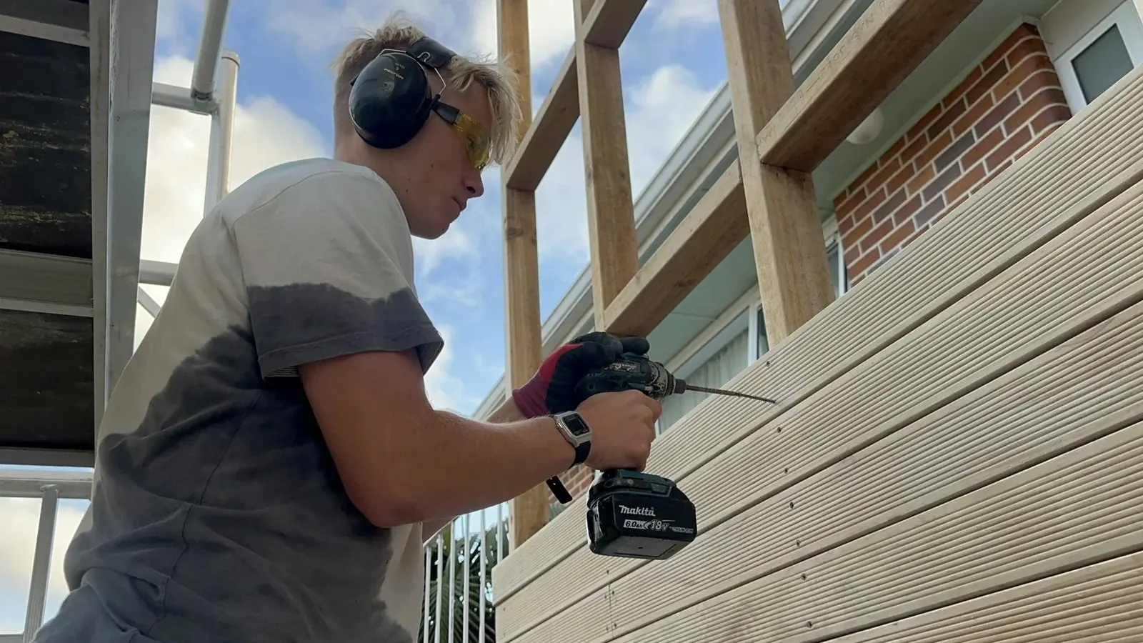 Fixing horizontal cladding boards to the new exterior timber frame in Howick