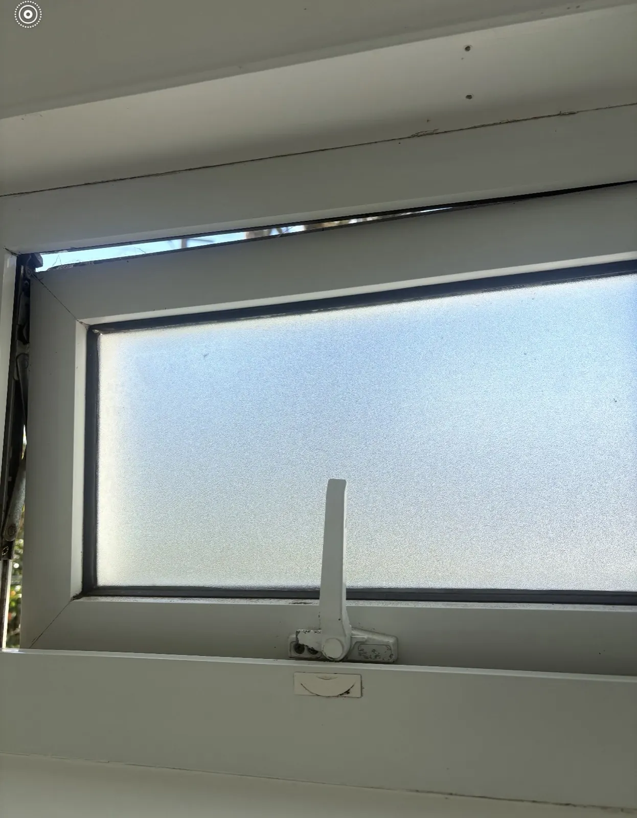 Double glazed PVC sash sitting crooked in its frame with a strip of daylight along the top edge