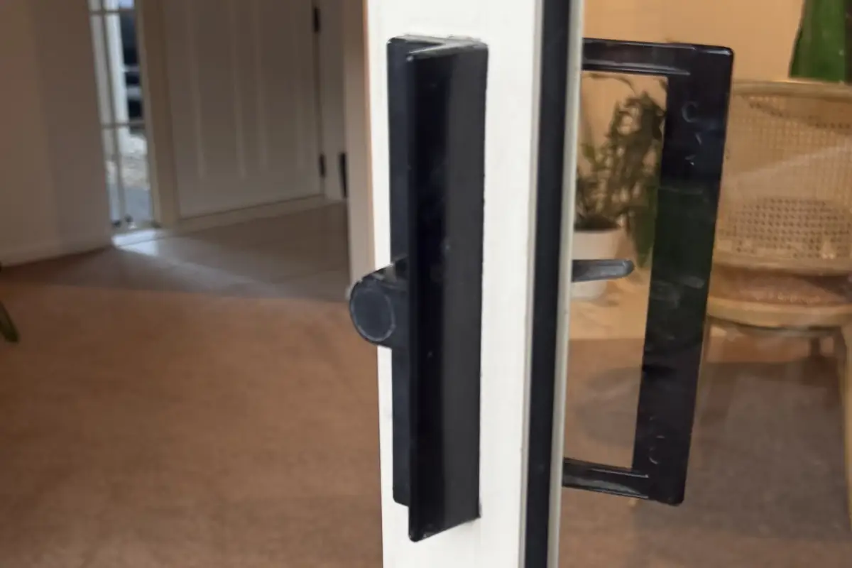Old black sliding door lock in a Botany home with a blind plug fitted where the key barrel would normally sit