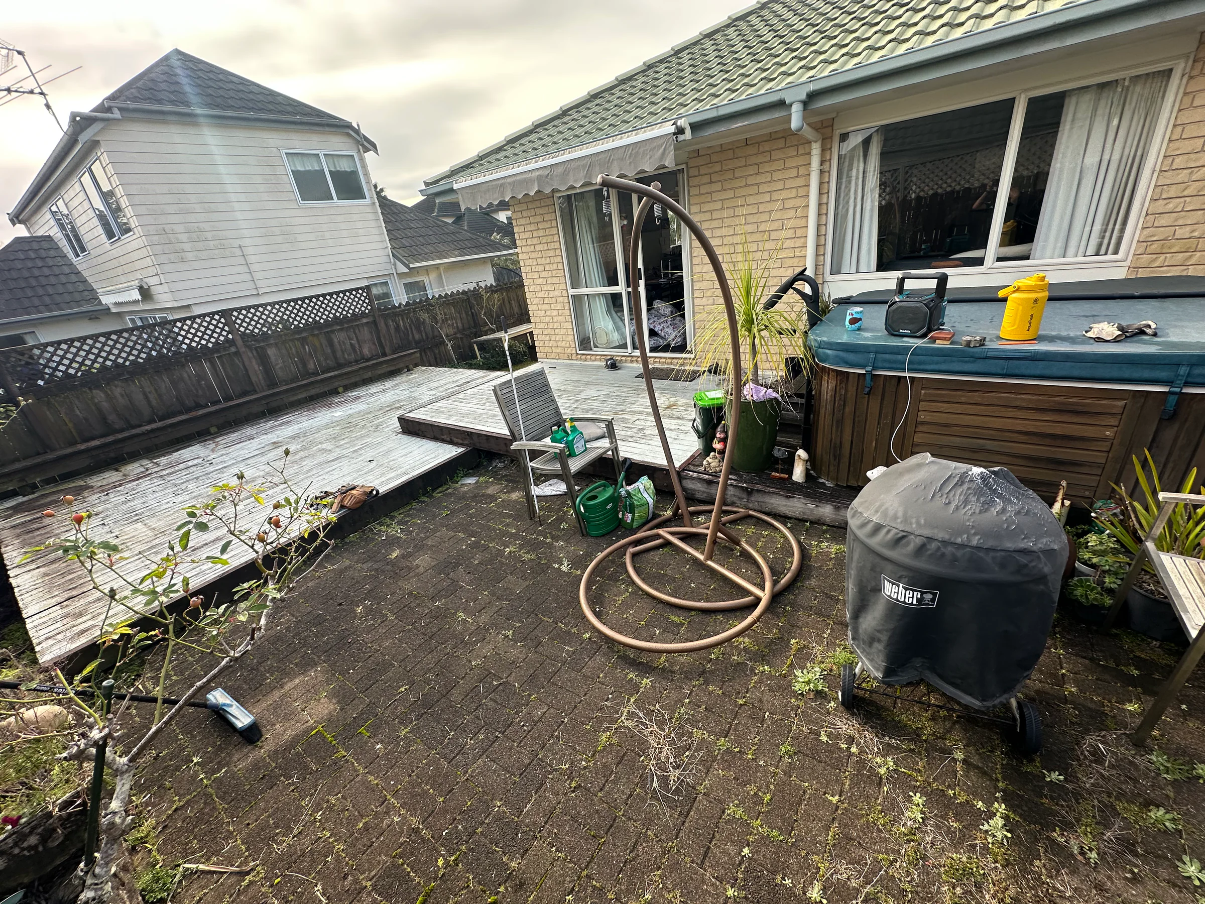 Weathered timber decking before replacement at a Botany home in East Auckland