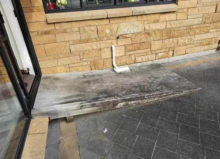 Worn timber ramp before rebuild in Northpark, East Auckland