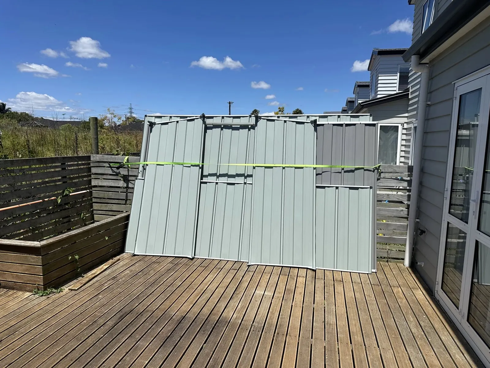 Metal garden shed wall panels assembled as separate blocks before installation