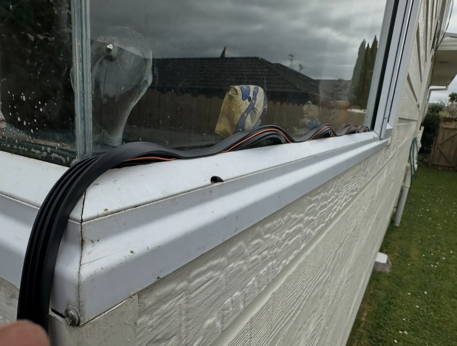Perished window glazing seal pulled out and lying on the sill in Pakuranga Heights