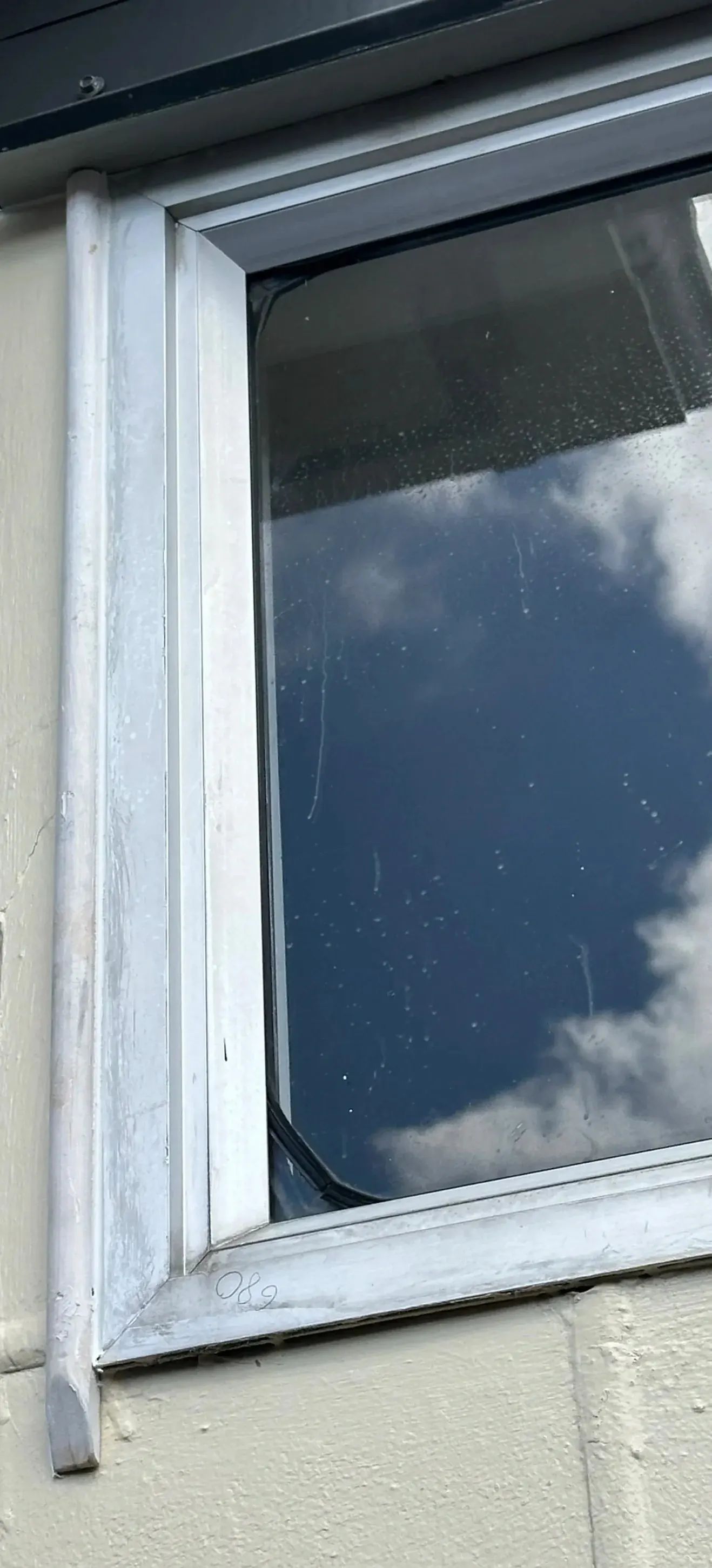 New custom scribe installed over window flashing during a Botany window repair project