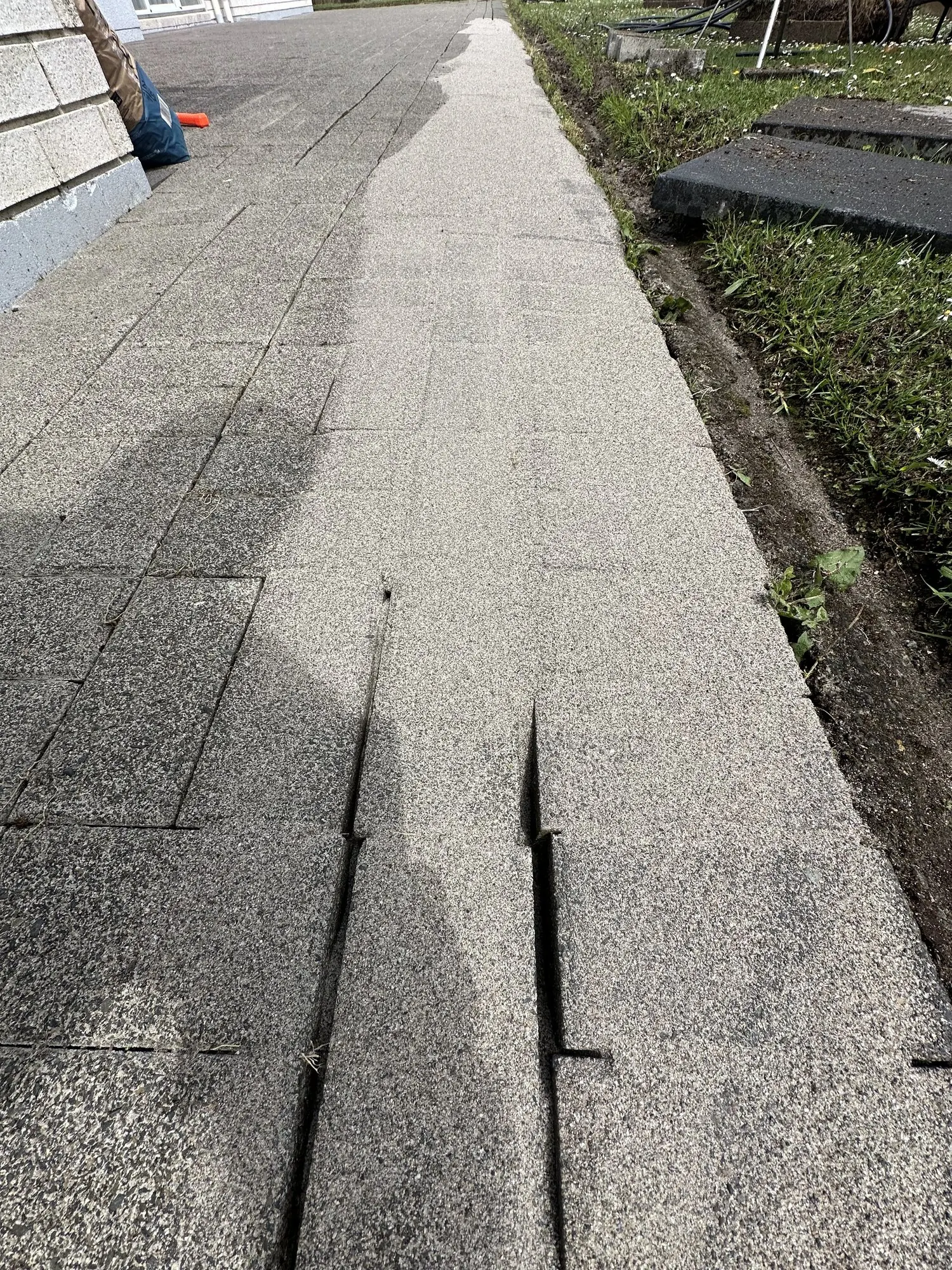 Paving jointing sand with binder being spread across cleaned pavers in Golflands