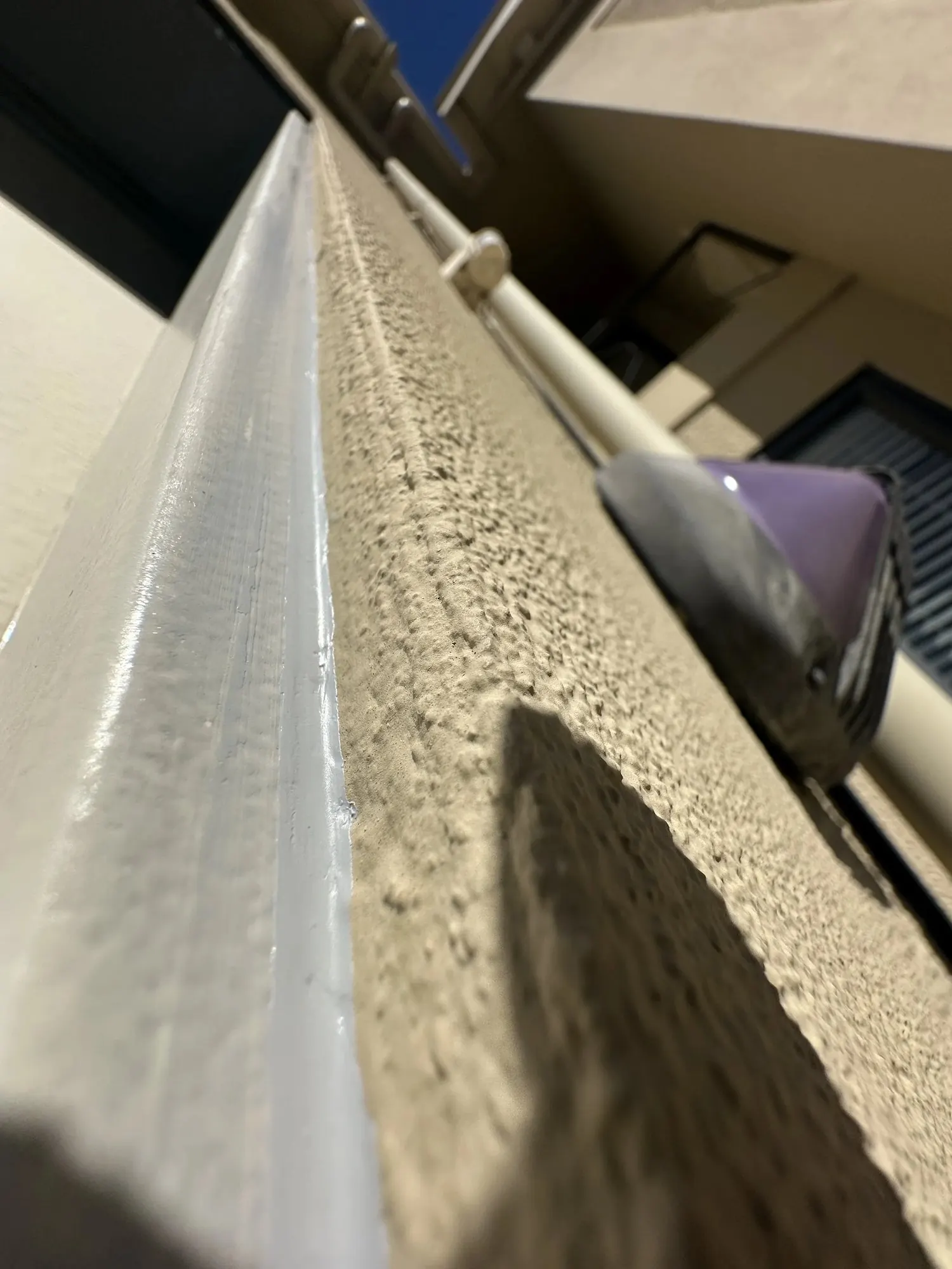 Exterior joint between the new garage door jamb and wall sealed to help prevent moisture entry